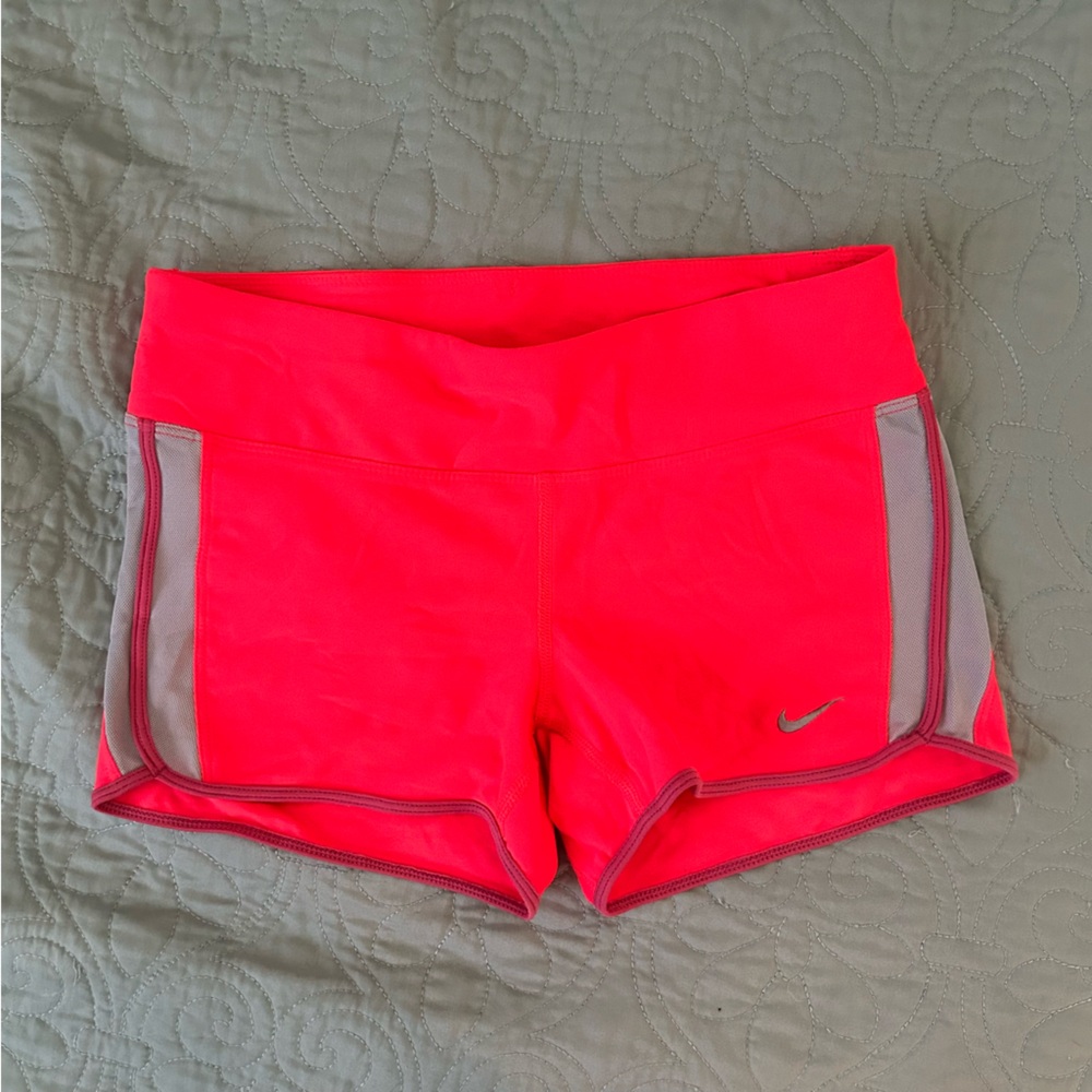 Nike Dri-fit tight running shorts, size medium, bright pink.